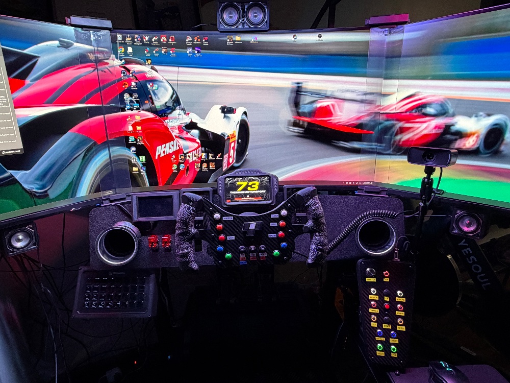 Theseus Motorsport sim racing rig and streaming workspace — full-width hero